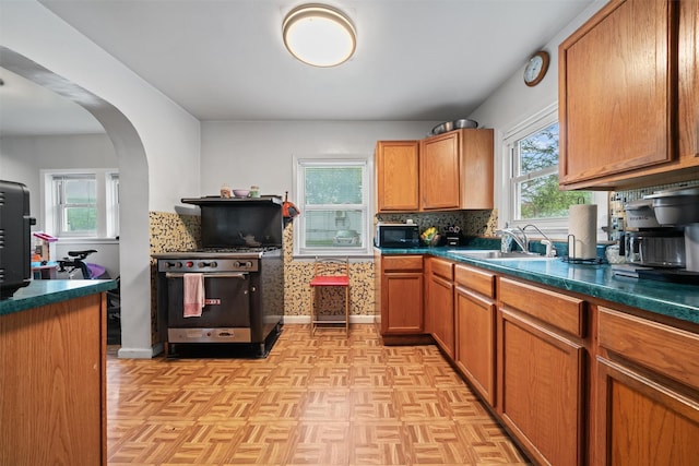 2 Random Rd, Greenwood Lake, NY 10925 - kitchen featuring stainless steel range, black microwave, a sink, arched walkways, and dark countertops