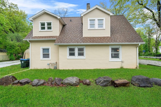 2 Random Rd, Greenwood Lake, NY 10925 - view of side of home featuring roof with shingles, stucco siding, and a yard