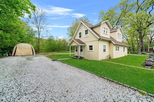 2 Random Rd, Greenwood Lake, NY 10925 - view of property exterior with stucco siding, roof with shingles, and a lawn