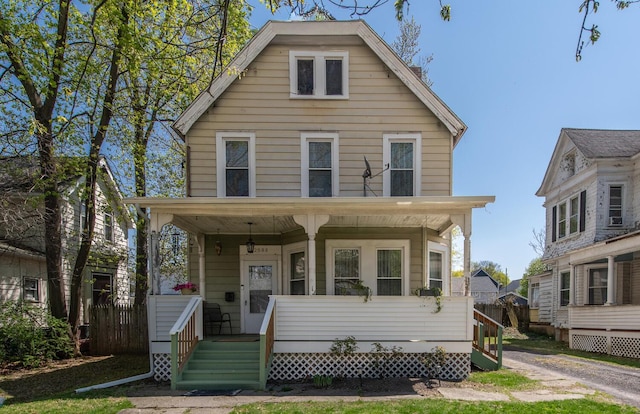 traditional style home featuring covered porch