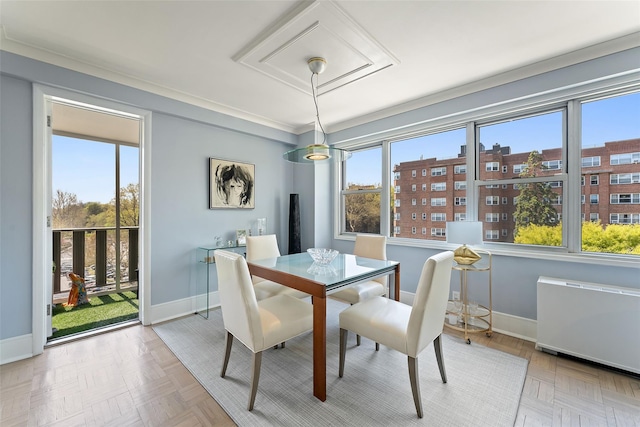 dining space with baseboards and radiator heating unit