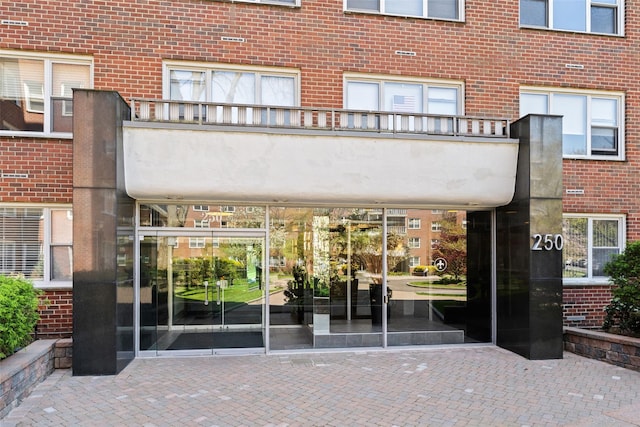 property entrance with brick siding