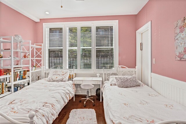 bedroom featuring wood finished floors