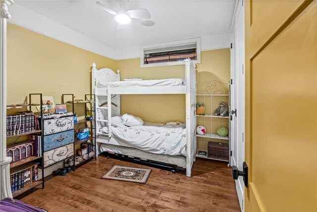 bedroom featuring ceiling fan and wood finished floors