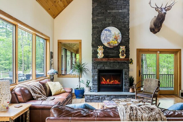 43 Bee Tree Ln, Accord, NY 12404 - living room featuring a stone fireplace, high vaulted ceiling, wood finished floors, and wood ceiling