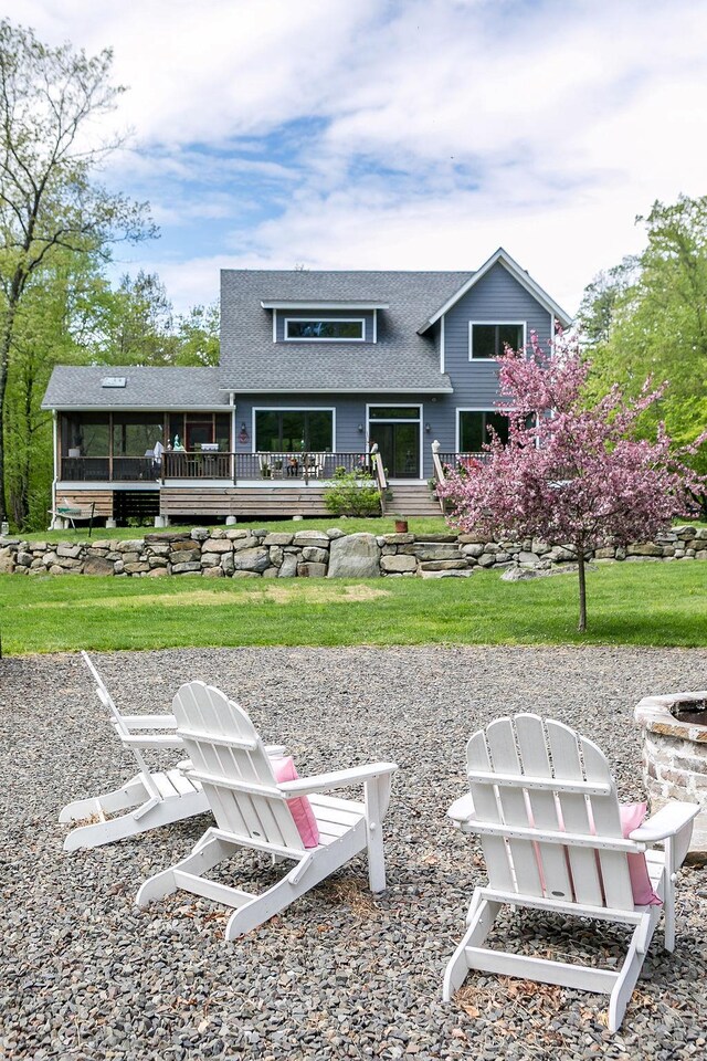 43 Bee Tree Ln, Accord, NY 12404 - rear view of house featuring an outdoor fire pit, roof with shingles, a wooden deck, and a yard