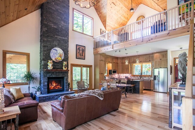 43 Bee Tree Ln, Accord, NY 12404 - living area featuring high vaulted ceiling, light wood-style floors, wooden ceiling, and a fireplace
