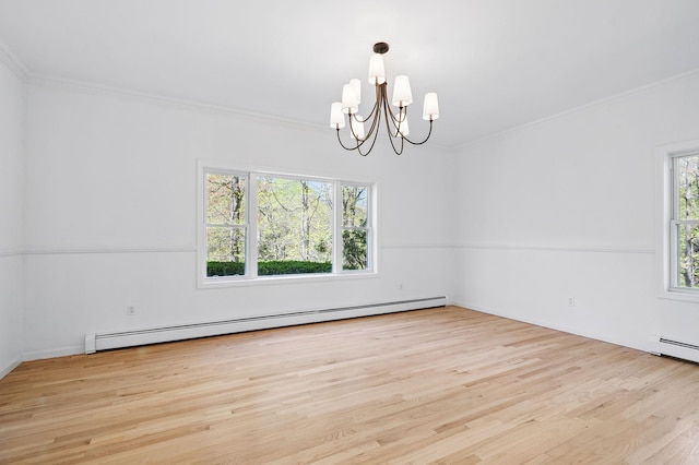 empty room featuring crown molding, a baseboard heating unit, wood finished floors, and a notable chandelier