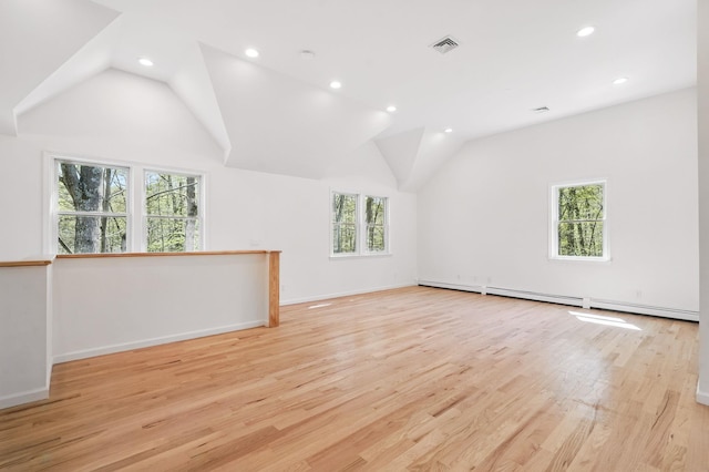 additional living space with visible vents, recessed lighting, light wood-style floors, and lofted ceiling