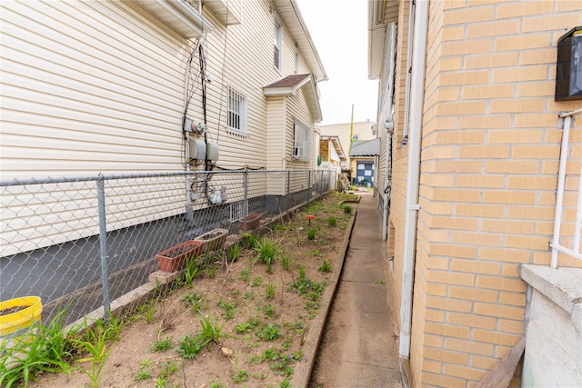 view of home's exterior with fence