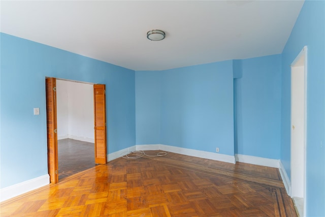 empty room featuring baseboards