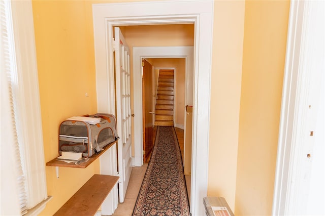 corridor with light tile patterned floors