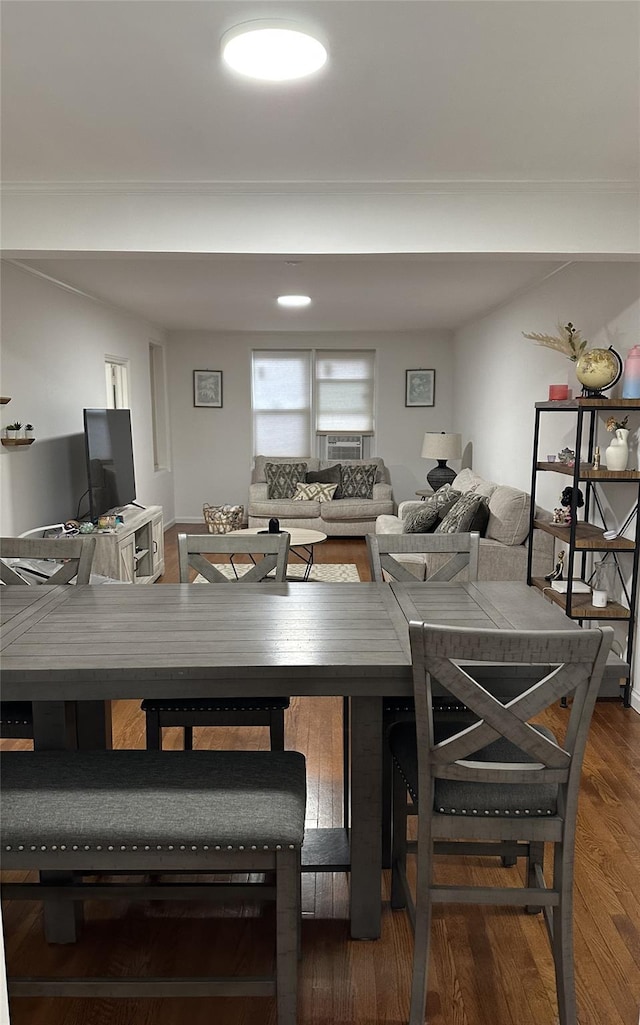 dining space featuring wood finished floors