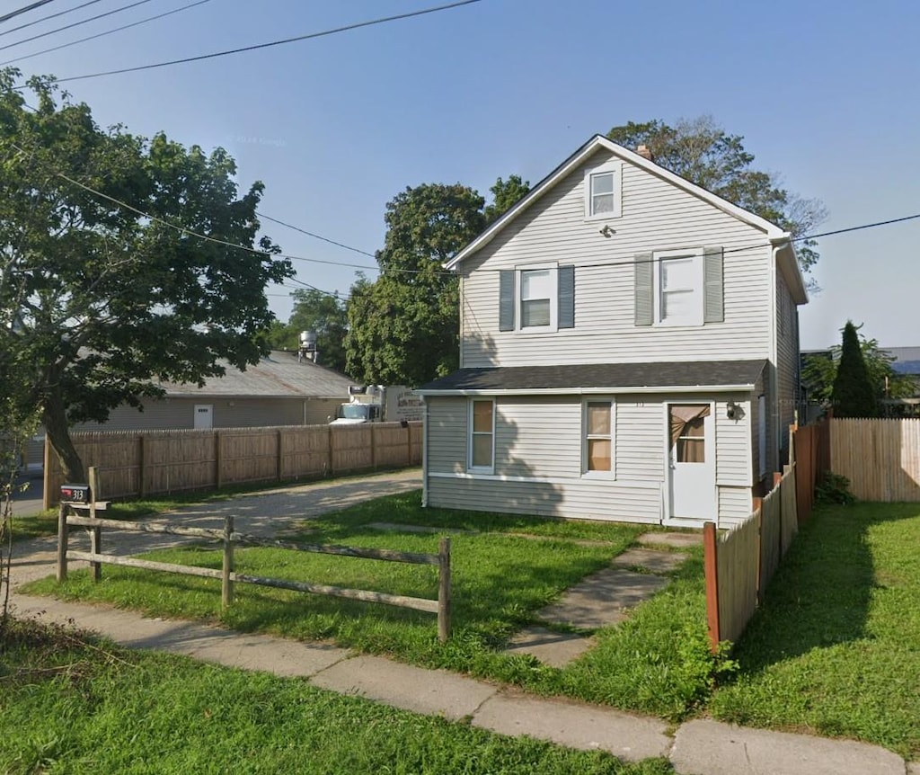 313 Osborn Ave, Riverhead, NY 11901 - view of front of property featuring a front lawn and fence