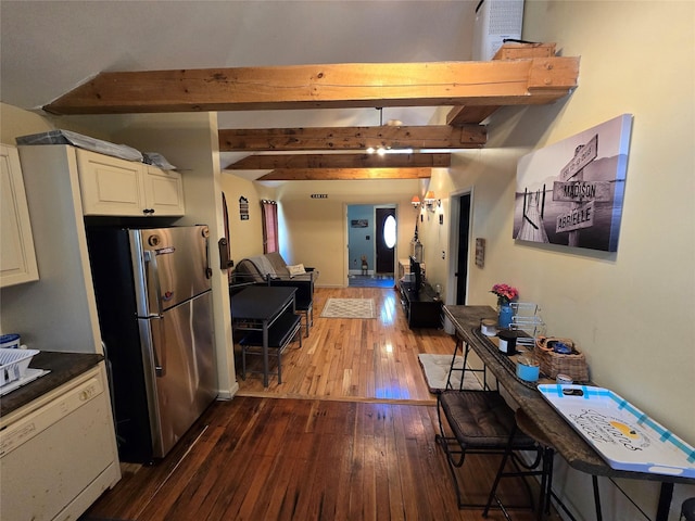 kitchen featuring freestanding refrigerator, dark wood finished floors, open floor plan, beamed ceiling, and white cabinets