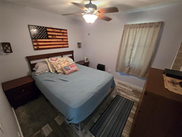 bedroom featuring ceiling fan and wood finished floors