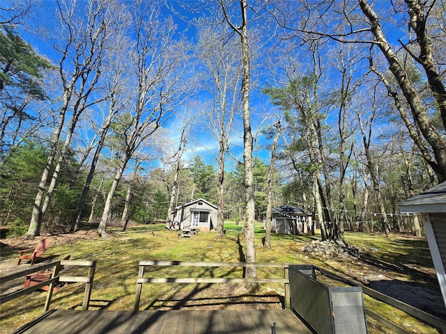 wooden deck with an outbuilding