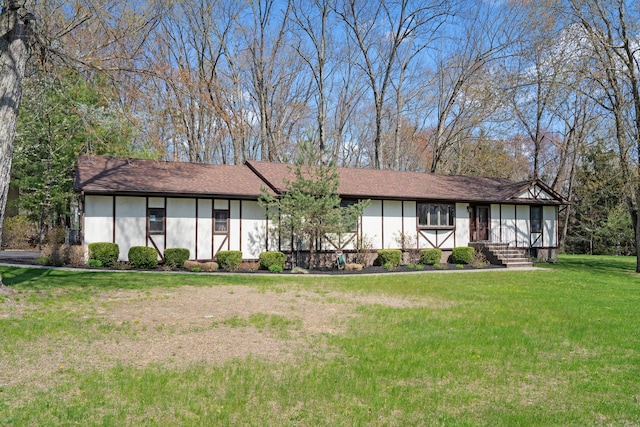 view of front of property with a front lawn and stucco siding
