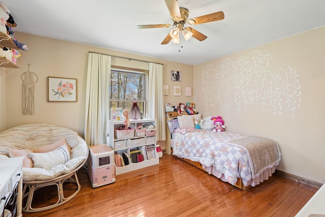 bedroom featuring ceiling fan and light wood finished floors
