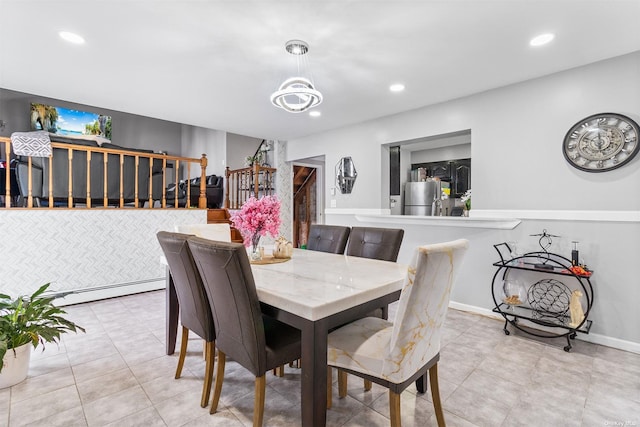 3641 Bertha Dr, Baldwin, NY 11510 - dining area featuring recessed lighting, a notable chandelier, tile patterned flooring, and stairway