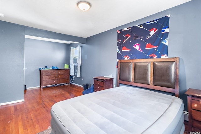3641 Bertha Dr, Baldwin, NY 11510 - bedroom featuring baseboards and wood finished floors