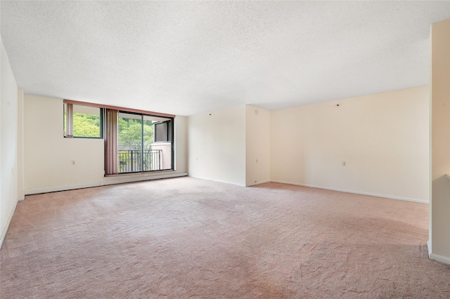 25 Rockledge Ave Unit 601, White Plains, NY 10601 - spare room with a textured ceiling, light colored carpet, and baseboards