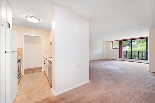 25 Rockledge Ave Unit 601, White Plains, NY 10601 - hallway with light carpet and baseboards