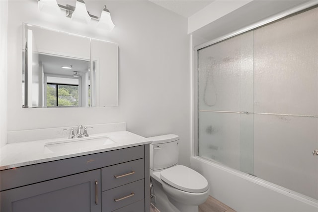 25 Rockledge Ave Unit 601, White Plains, NY 10601 - bathroom featuring vanity, toilet, and combined bath / shower with glass door