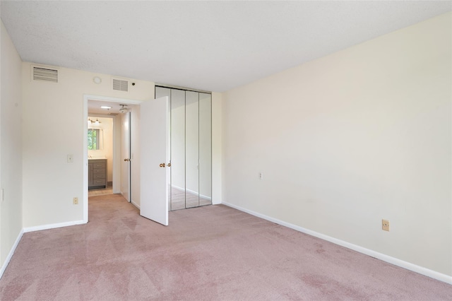 25 Rockledge Ave Unit 601, White Plains, NY 10601 - unfurnished bedroom featuring light carpet, baseboards, and a closet