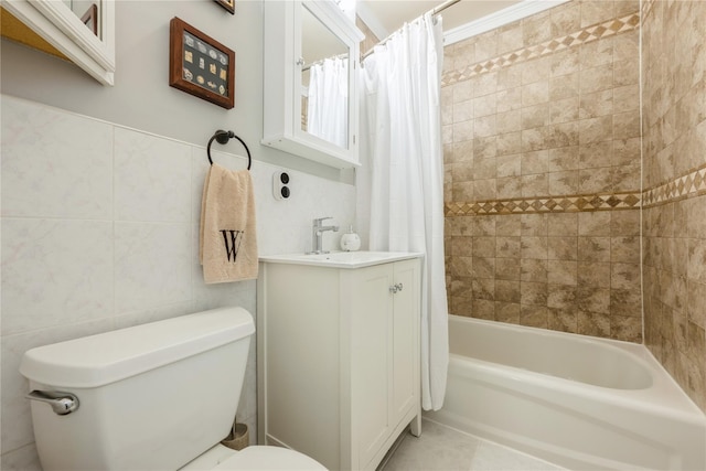 full bath featuring vanity, shower / tub combo, toilet, and tile walls