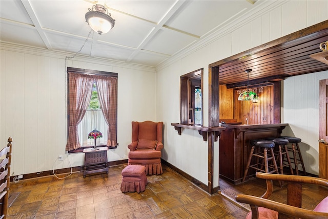 sitting room with baseboards, a dry bar, and coffered ceiling