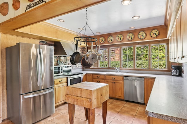 kitchen with light tile patterned floors, appliances with stainless steel finishes, a sink, and recessed lighting