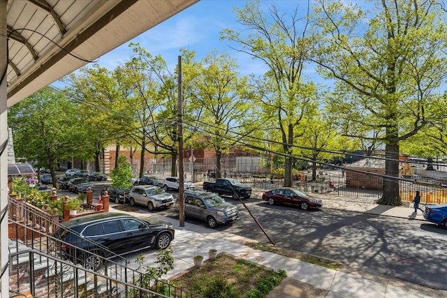 uncovered parking lot with fence