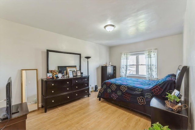 bedroom featuring wood finished floors