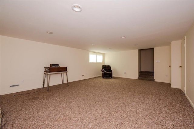 below grade area with carpet floors, recessed lighting, and baseboards