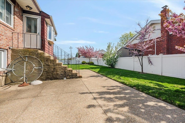 exterior space featuring stairs and concrete driveway