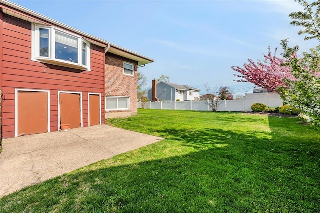 view of yard featuring fence and a patio area