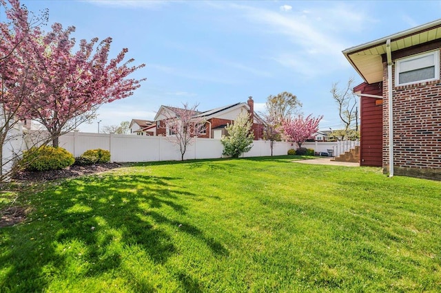 view of yard with fence