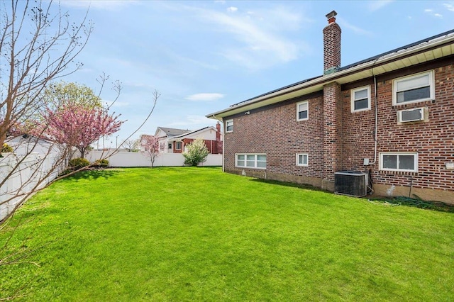 exterior space featuring central AC and a fenced backyard