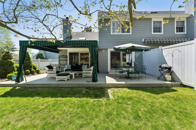 back of house with an outdoor living space, a fenced backyard, a lawn, and a patio area