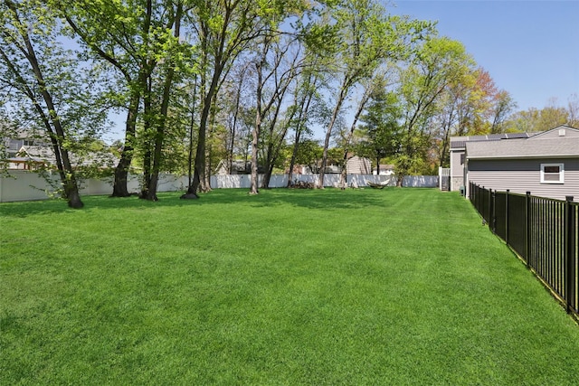 view of yard with a fenced backyard