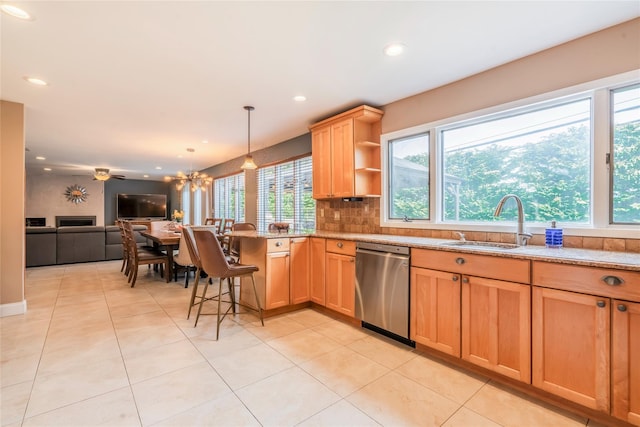 kitchen with open shelves, dishwasher, a sink, a peninsula, and open floor plan
