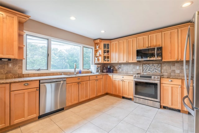 kitchen with open shelves, appliances with stainless steel finishes, and tasteful backsplash