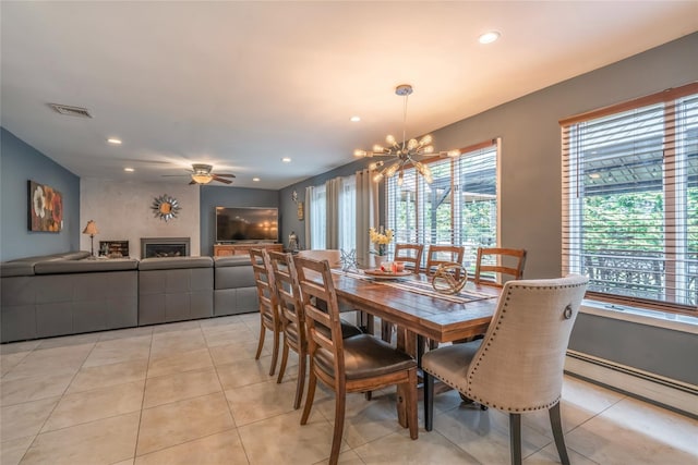 dining space featuring recessed lighting, visible vents, light tile patterned flooring, and ceiling fan with notable chandelier