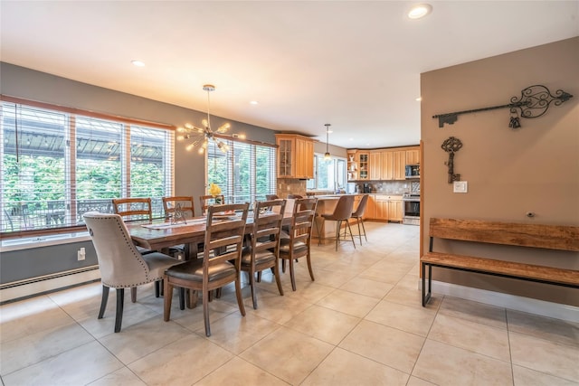 dining space featuring recessed lighting, a chandelier, and light tile patterned floors