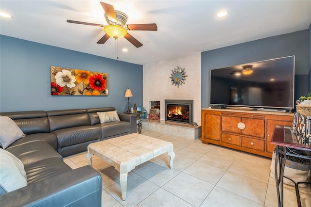 living room with a ceiling fan, recessed lighting, light tile patterned floors, and a fireplace