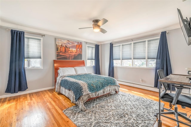 bedroom featuring ornamental molding and multiple windows