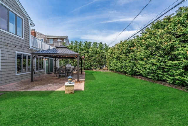 view of yard featuring a gazebo and a patio area