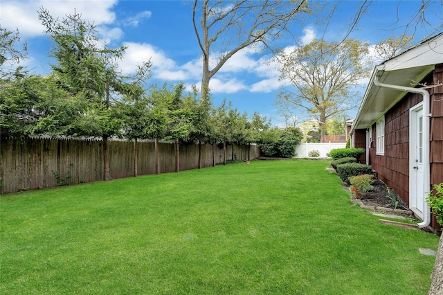 view of yard featuring a fenced backyard
