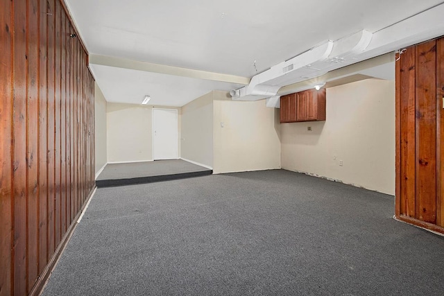 interior space featuring visible vents and dark colored carpet